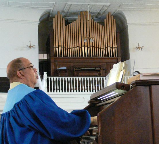photo of organist and old & new organs